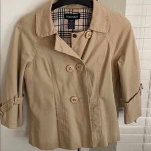 Tan jacket with plaid interior.